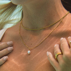 Perle d'Été — baroque pearl pendant on tan skin
